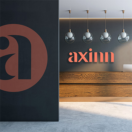 Contemporary office entrance space with Axinn branding